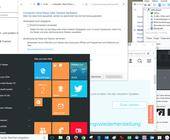 Ein Windows-10-Desktop mit Startmenü und geöffneten Fenstern