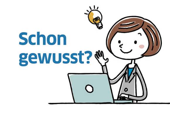 Cartoon-Figur an einem Notebook 