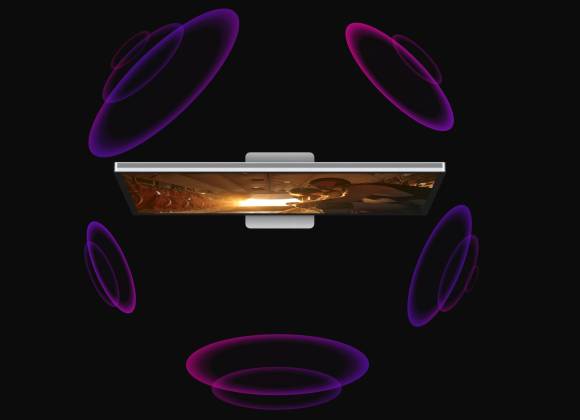 Die Lautsprecher klingen hervorragend, auch wenn der 3D-Effekt nicht so ausgeprägt zum Tragen kommt, wie hier illustriert Das Foto zeigt ein Studio Display von oben; fünf illustrierte Laufsprecher zeigen den Surround-Effekt
