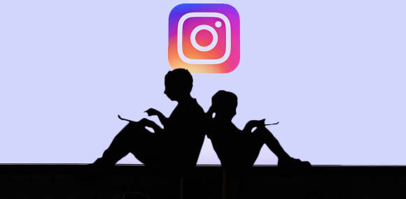 Symbolbild zeigt die Silhouette zweier Kinder, im Hintergrund ein Instagram-Logo 