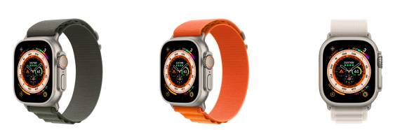 Drei Apple Watches mit Stoffarmbändern in Grau, Orange, Weiss