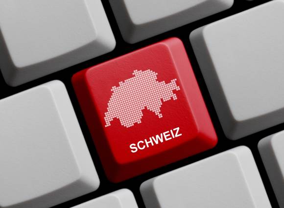 Symbolbild zeigt Umrisse der Schweiz auf einer Tastatur-Taste